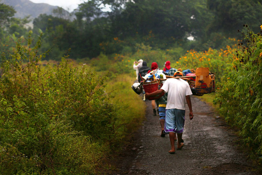 Porters load during hiking to Mount Rinjani