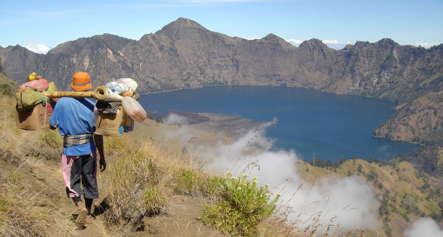 Burden on the shoulders of our porters during hiking to Mount Rinjani fit 20 kg